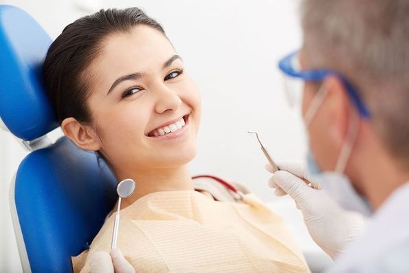 A smiling woman representing the great service at general dentistry office Byrd Adkins D.D.S. Smile Company in Amarillo, TX