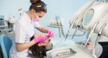 A dental professional working on a patient representing the services of general dentistry provider Byrd Adkins D.D.S. Smile Company in Amarillo, TX