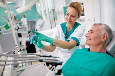 A dental professional and patient representing a first-time visit to general dentistry office Byrd Adkins D.D.S. Smile Company in Amarillo, TX